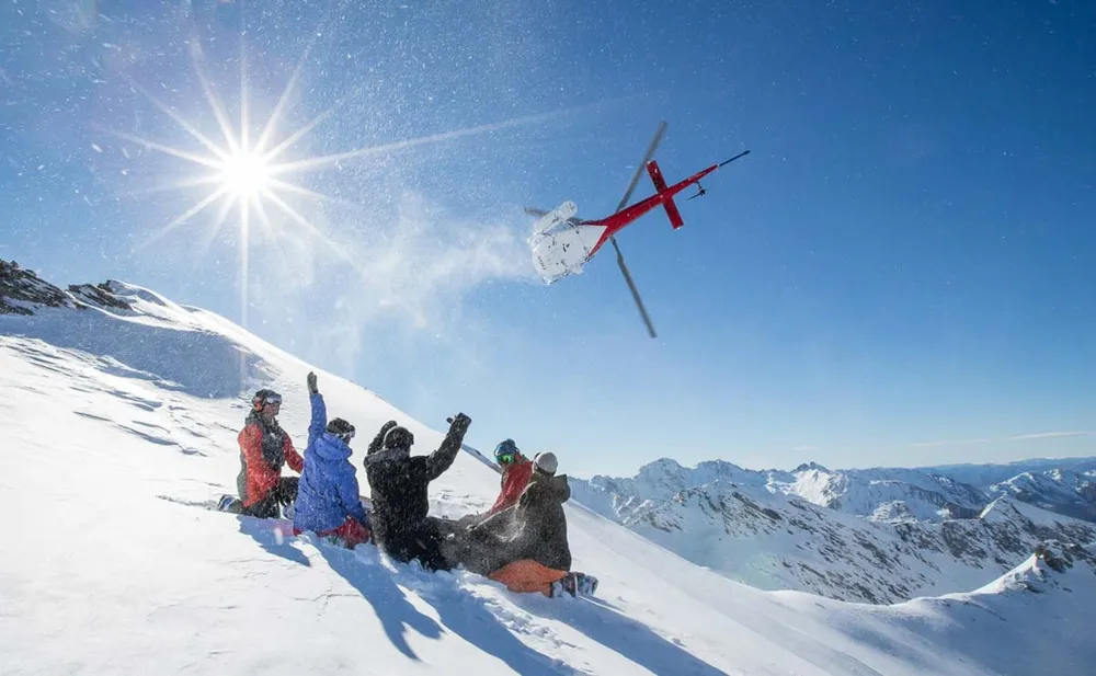 Heli-skiing is off-trail, downhill skiing or snowboarding reached by helicopter, instead of a ski lift.